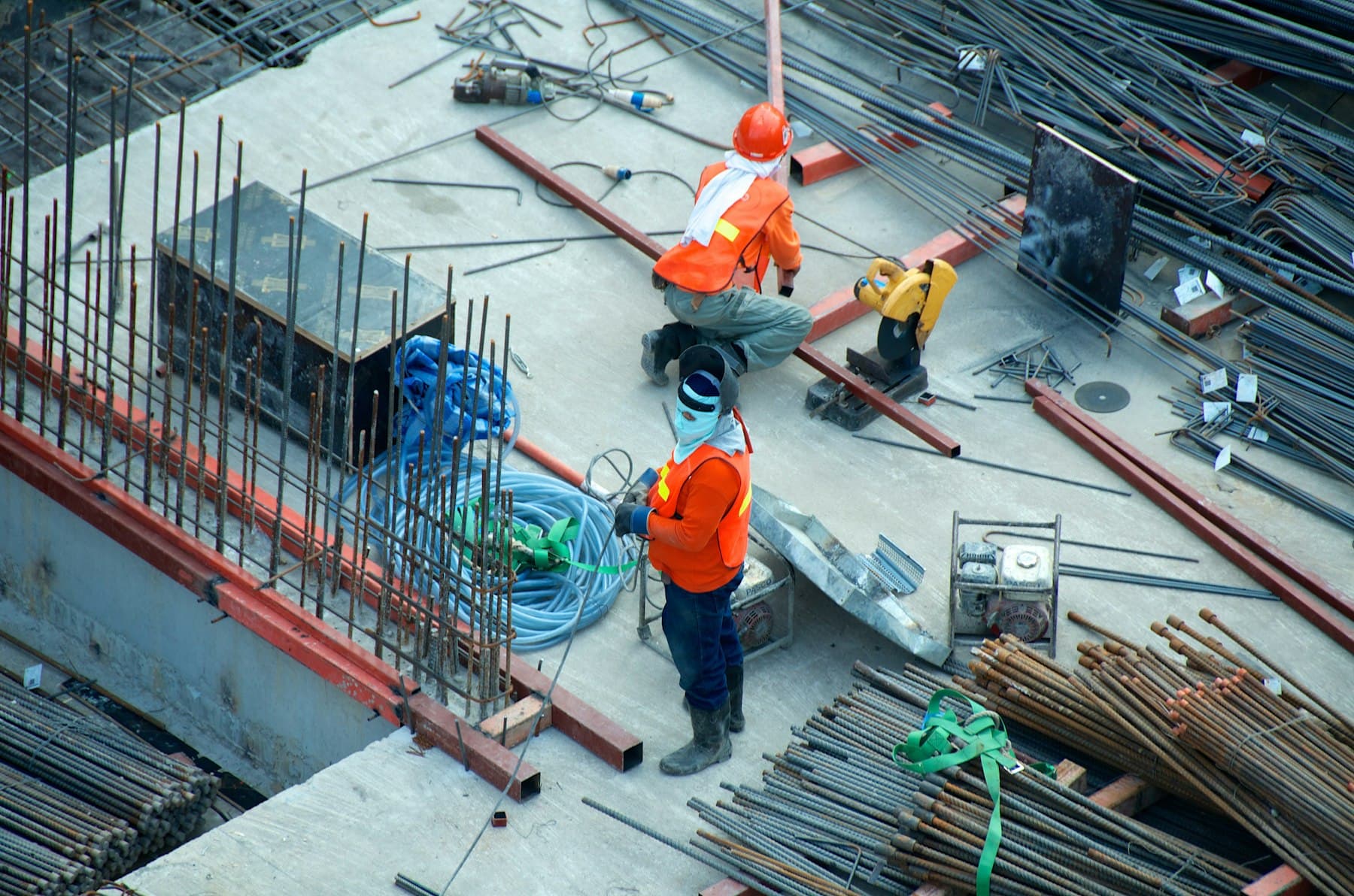 Crew members installing metal framing on a commercial deck