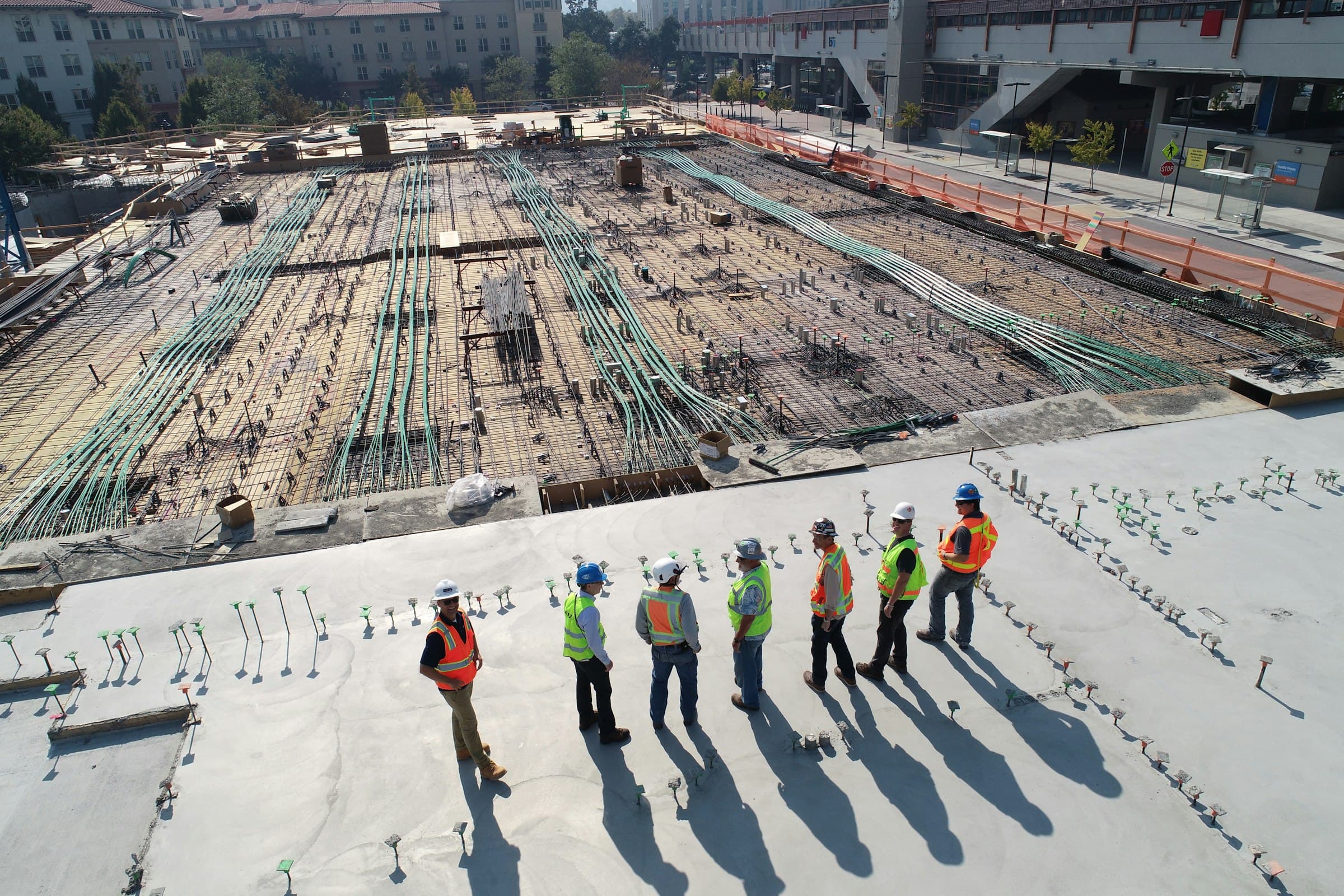 Commercial construction team coordinating on a large-scale jobsite